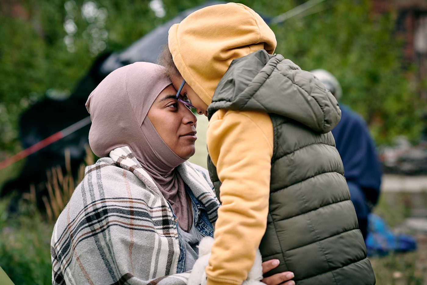 A mother holding her child close